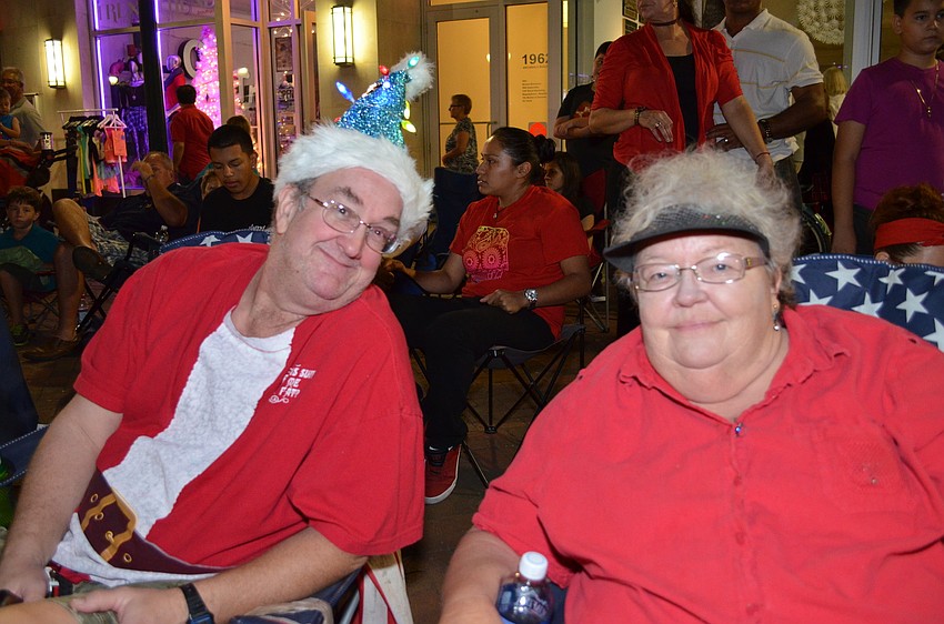 Kevin and Susan Most wait for the Downtown Sarasota Parade to start Saturday evening.