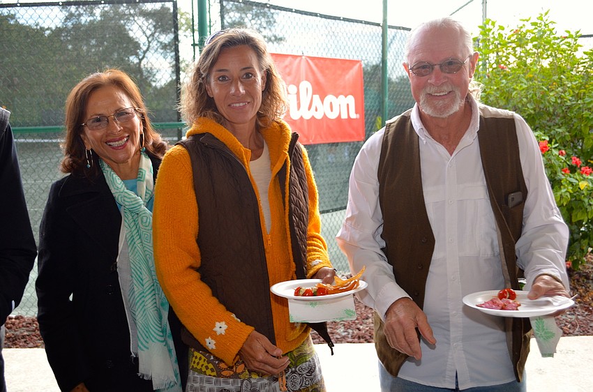 Lily Johnson meets friends and smiling faces â€” Angie and Gary Eason.