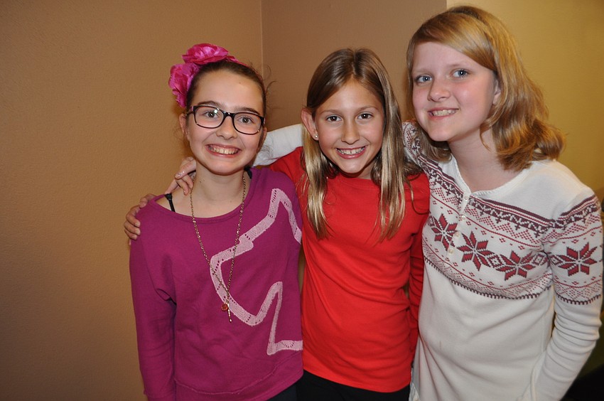 Melodie Dube, Caroline Pope and Sheri Benson wait to see Santa.