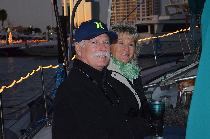 Bill and Judy Smith watch the parade from a boat.