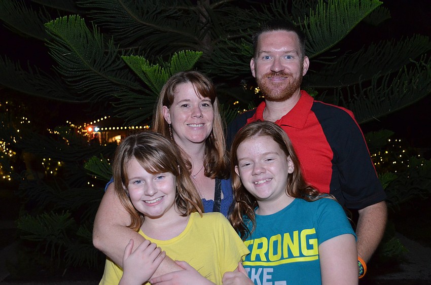 Laura Sabin attends the Holly Holiday Party with her husband Jess, daughters Katie and Samantha.