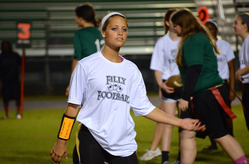 Ninth-grade student Olivia Danko plays quarterback.