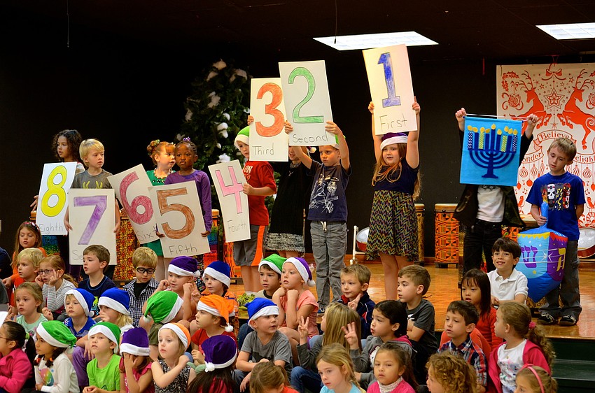 Kindergarten students sing songs for Hanukkah.