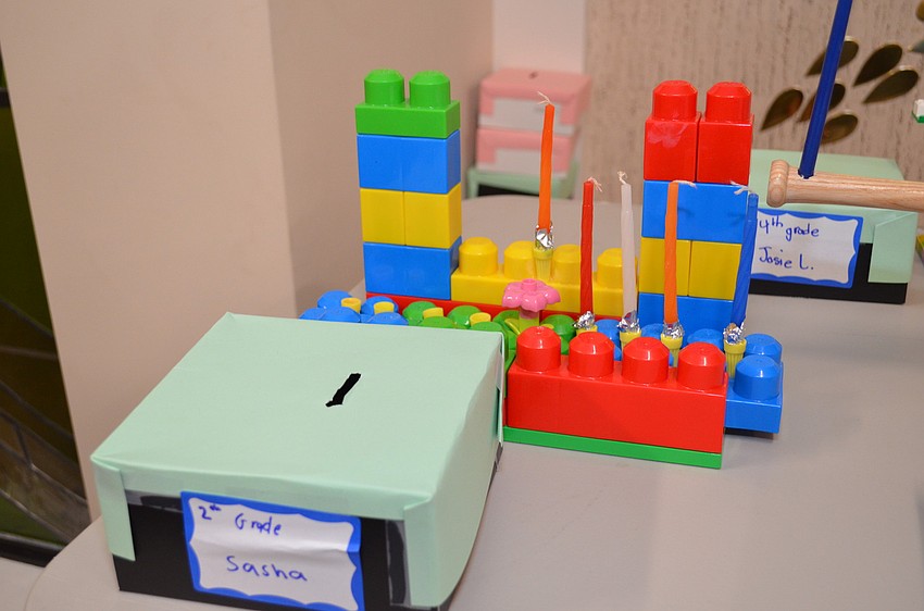 A menorah made out of Lego building blocks.