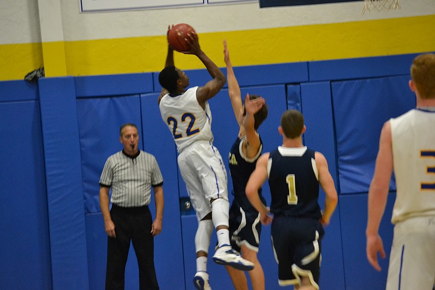 Brion Whitley shoots for two of his 9 points in the game.