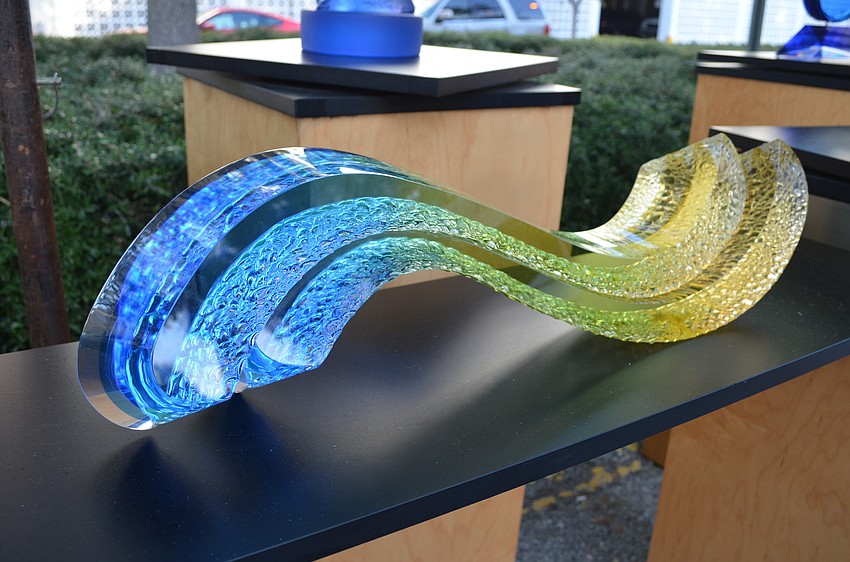 An acrylic sculpture by Michael George titled Tidal Wave.