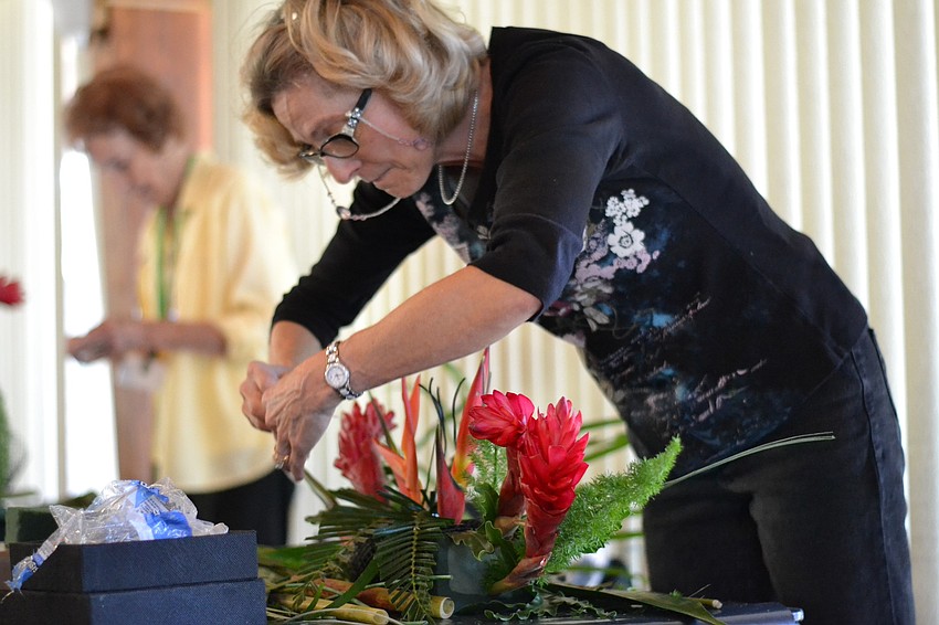 Emily Yaffe prunes her floral design.