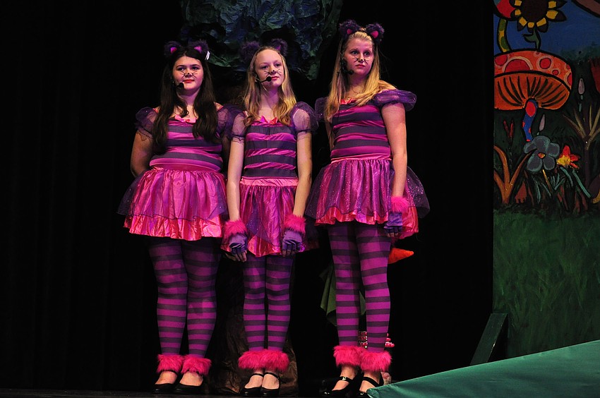 Rebecca Cole, Bella Young and Bridgette Bach, together, are the Cheshire Cat.