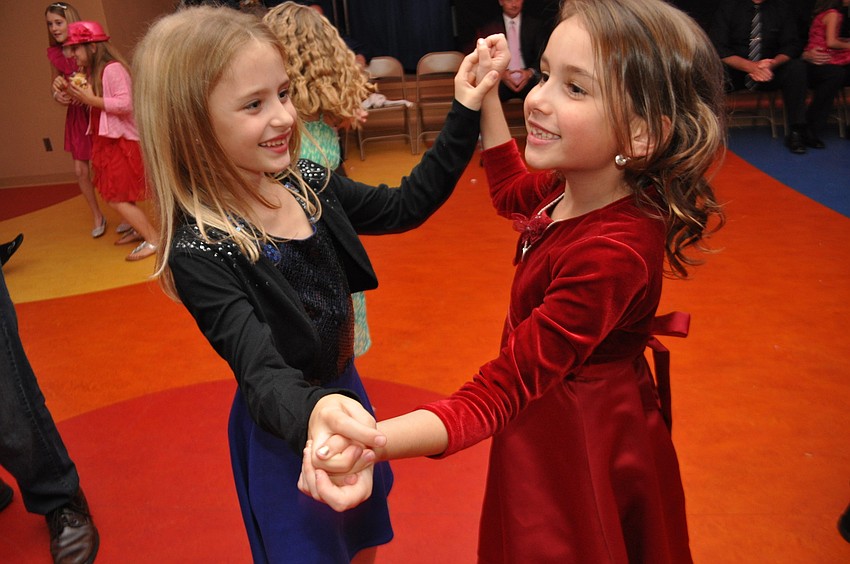 Melody Fetterman and Nina Fitzgerald dance the night away.