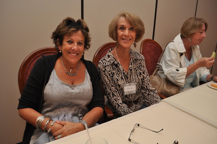 Silvia Golueke and Anelisa Murphy chat with friends.