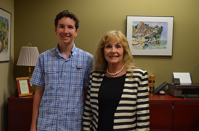 Country Club Shores resident Matthew Mason and Commissioner Lynn Larson