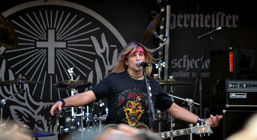 Guitarist and vocalists Joey Bravo performs for the band Lazy Bonez.