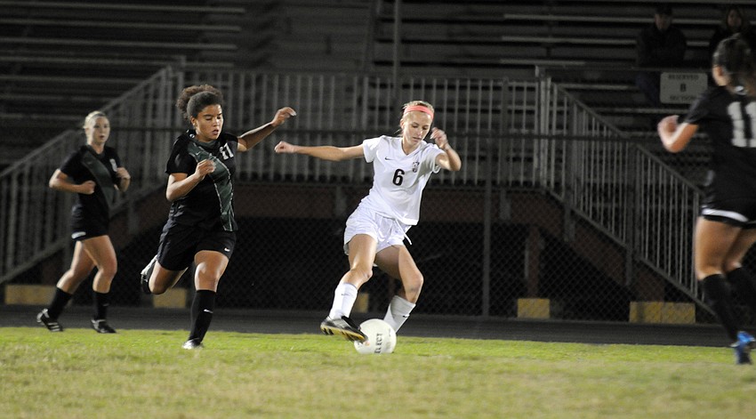 Riverview's Amy Dunn attempts the maintain possession for the Lady Rams.