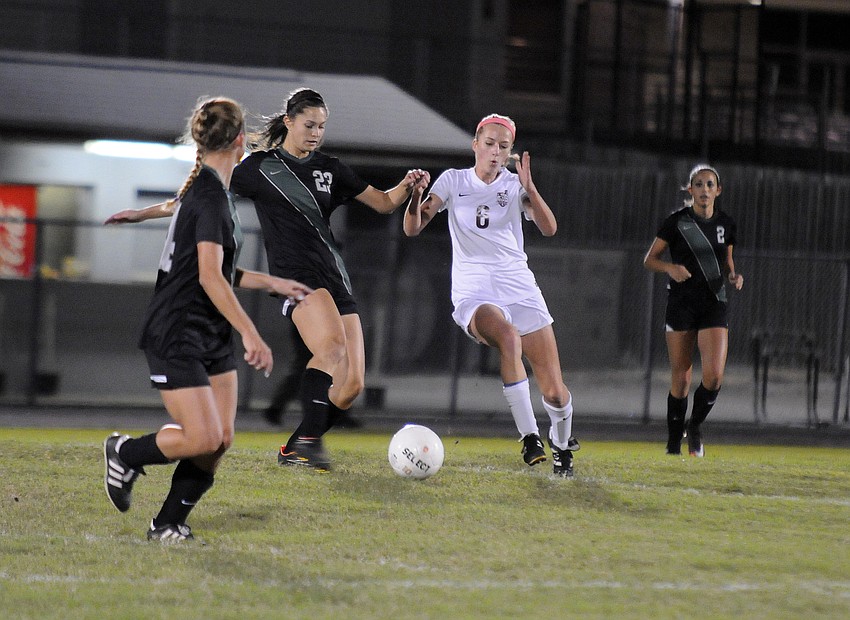 Riverview's Amy Dunn battles Lakewood Ranch's Kerestyn Kesgiropoulos for possession.