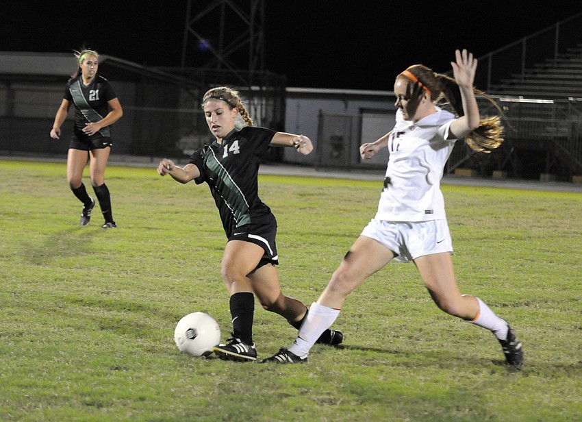 Riverview's Jordan Evens attempts to steal the ball from Lakewood Ranch's Noelle Kourakos.