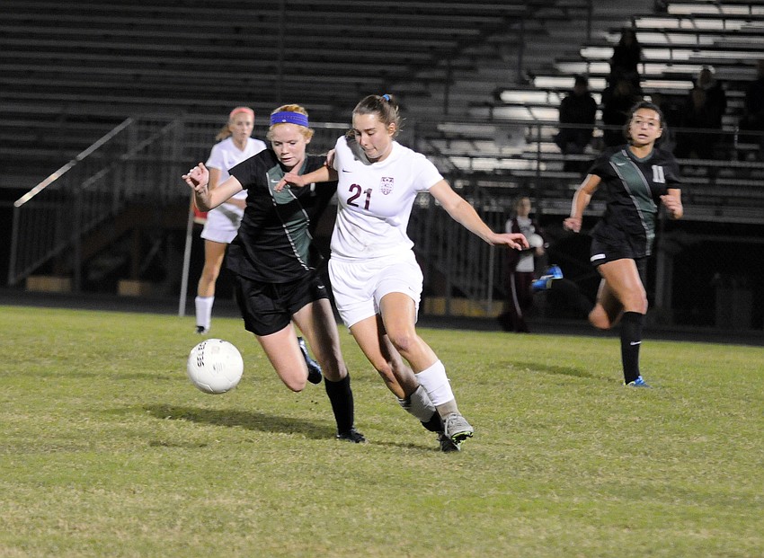 Riverview's Natalie Hulliger attempts to maneuver past Lakewood Ranch's Caitlyn Klein.