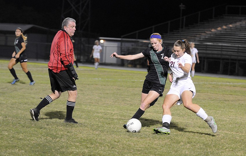 Lakewood Ranch's Caitlyn Klein and Riverview's Natalie Hulliger battle for the ball during their district game Dec. 18.