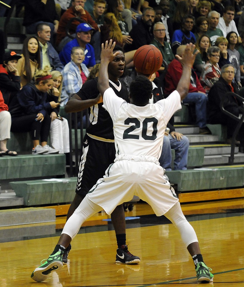 Braden River junior guard Deoni Cason looks to pass the ball around Lakewood Ranch's Devin Twenty.