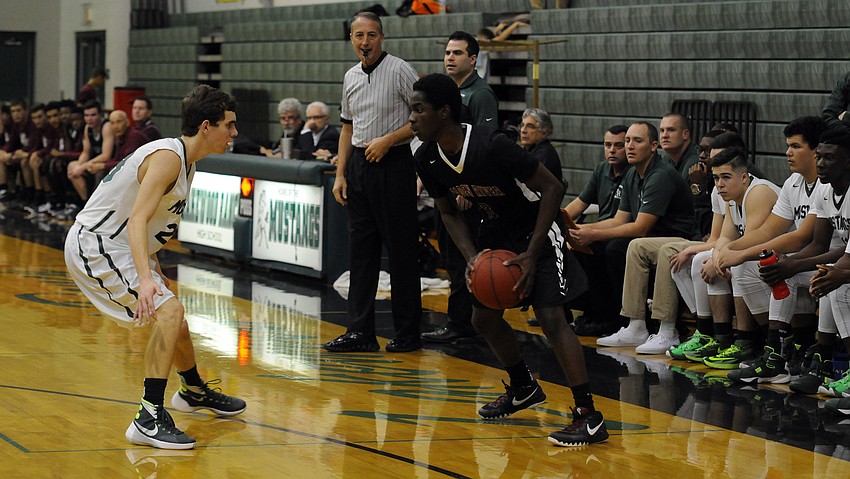 Braden River junior guard Deoni Cason attempts to maneuver past Lakewood Ranch's Brock Sisson.