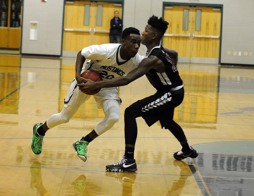 Lakewood Ranch's Devin Twenty drives to the hoop against Braden River's Jamal Owens.