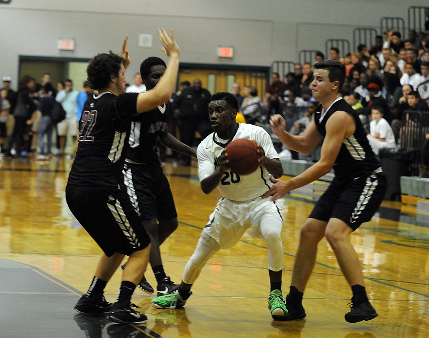 Braden River's Tyler Dyson, Deoni Cason and Daniel Tart attempt to trap Lakewood Ranch's Devin Twenty.