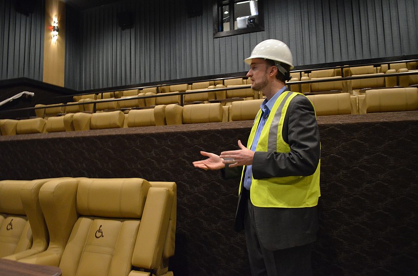 CineBistro Regional Operations Director Matt Russell leads a media tour of one of the nearly completed theaters.