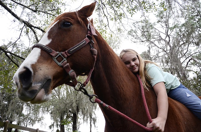 Lexi Parks rides her horse, Chance, in barrel racing.