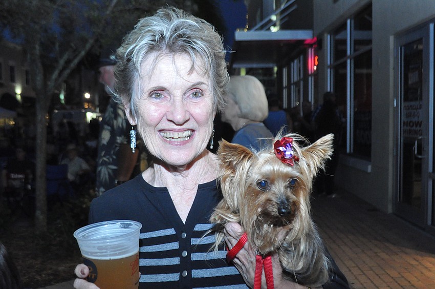 East County resident Loretta Bowman and her pup Casey enjoy the Hatley Band.