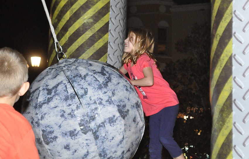 Lakewood Ranch resident Ryann Gurski tries to knock down her opponents in an inflatable game brought by Grace Community Church.