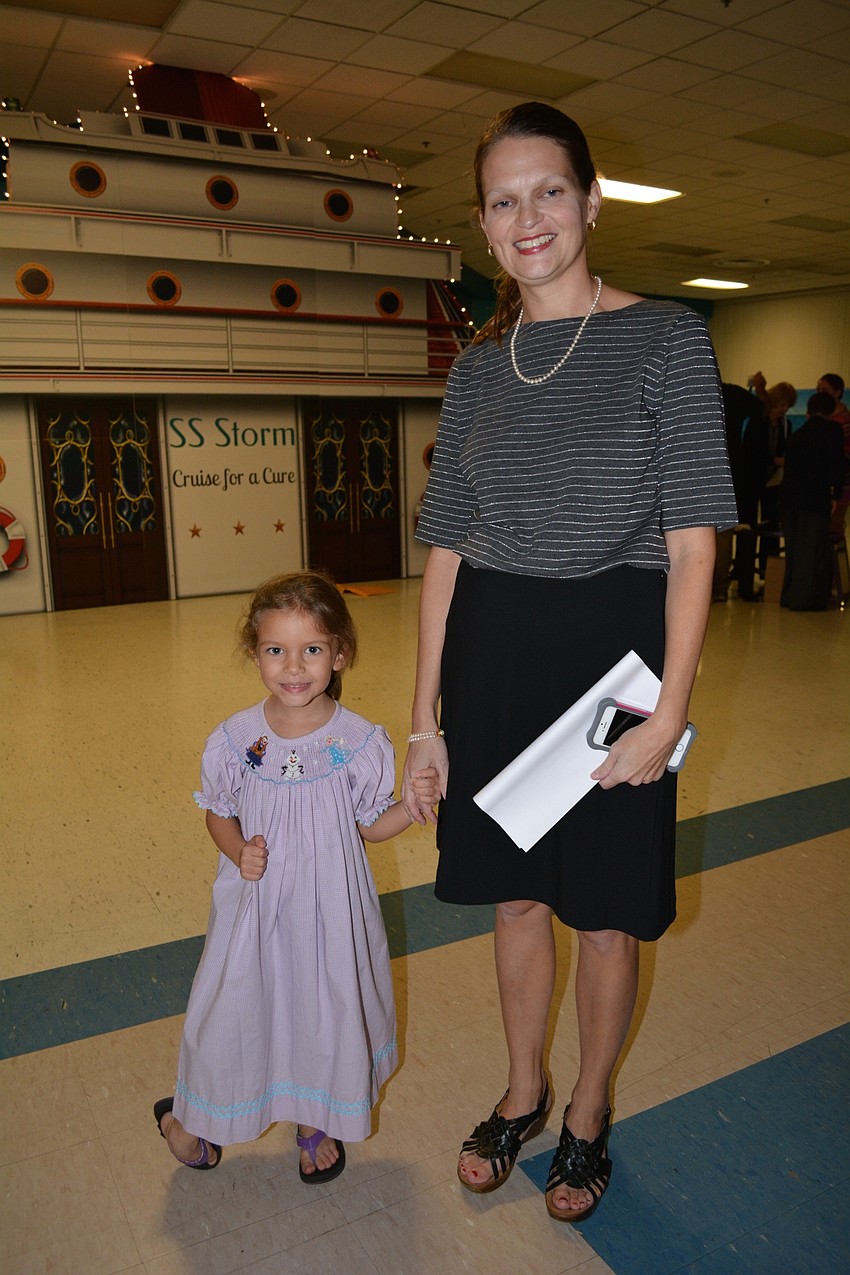 Bea and Carrie Holton helped put out table decorations.