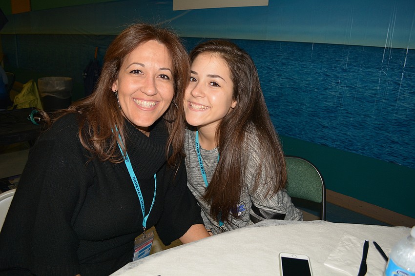 Betty and Brianna Alonso share the evening with friends.
