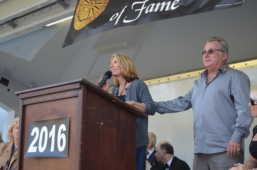 Bonnie Nicholas-Shine and Tuffy Nicholas accept the award on behalf of their father, Count Nicholas.