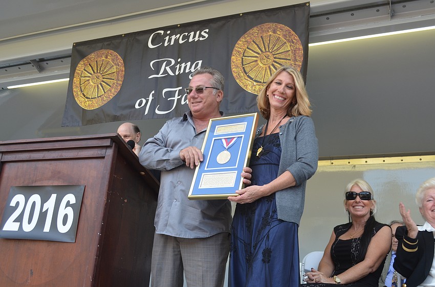Tuffy Nicholas and Bonnie Nicholas-Shine accept the award on behalf of their father, Count Nicholas.