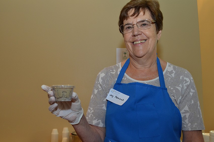 Joy Pelmont helped serve portions of the chopped liver.