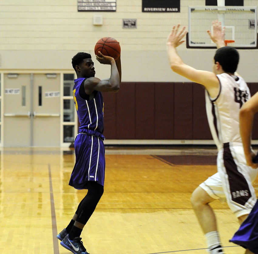 Booker sophomore Frederick Francois attempts a shot early in the first quarter.