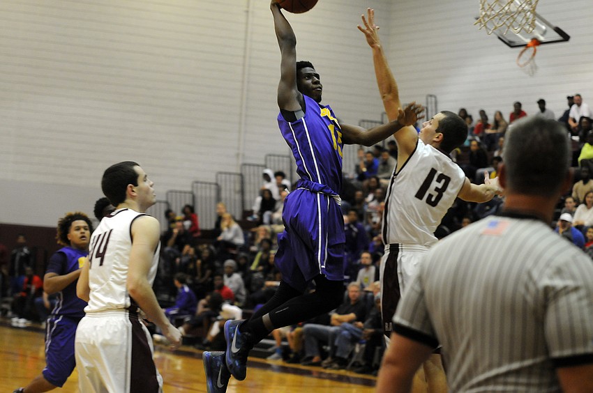 Booker sophomore Frederick Francois goes airborne in the first quarter.