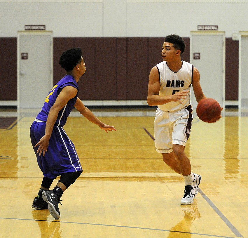 Riverview senior captain DJ Bryant brings the ball up the court for the Rams.