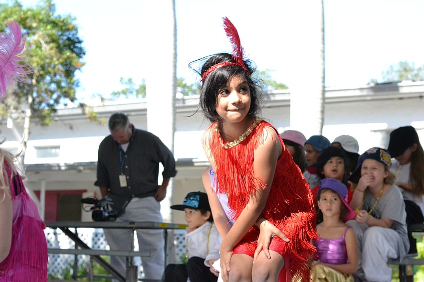 Students dressed as flappers dance to music from the 1920s.