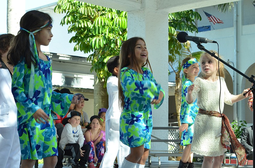 Students dressed in their best 1970s outfits dance to 