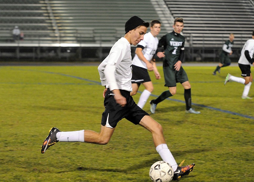 Senior midfielder Sebastian Fowler pushes the ball up the field for Lakewood Ranch.