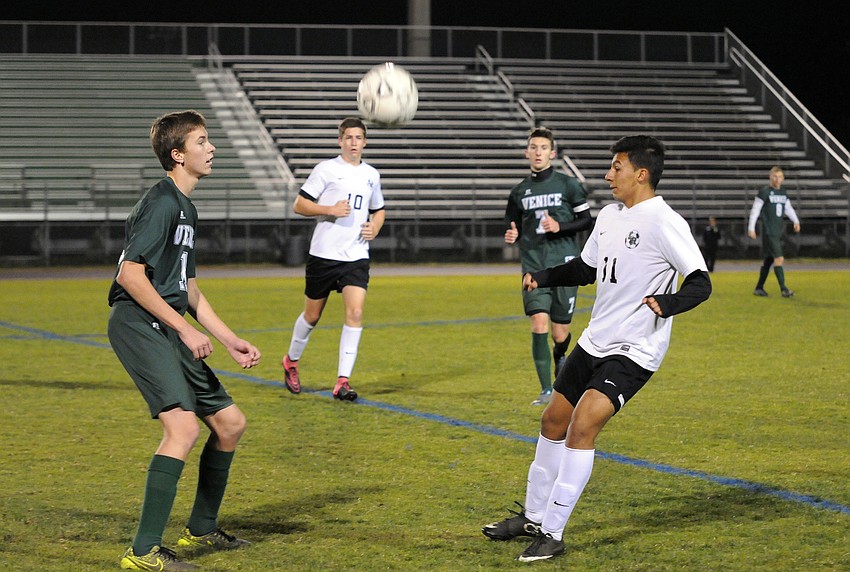 Lakewood Ranch's Pablo Vargas, right, waits for the ball to drop during the first half.