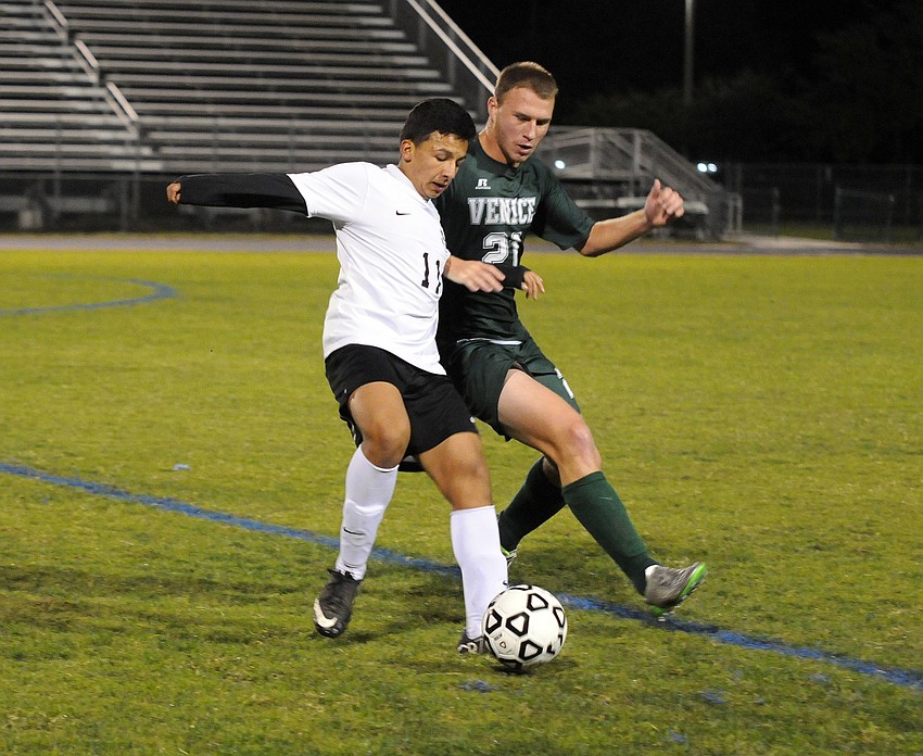 Lakewood Ranchs sophomore forward Pablo Vargas battles Venice's Christian Kuffer for the ball.