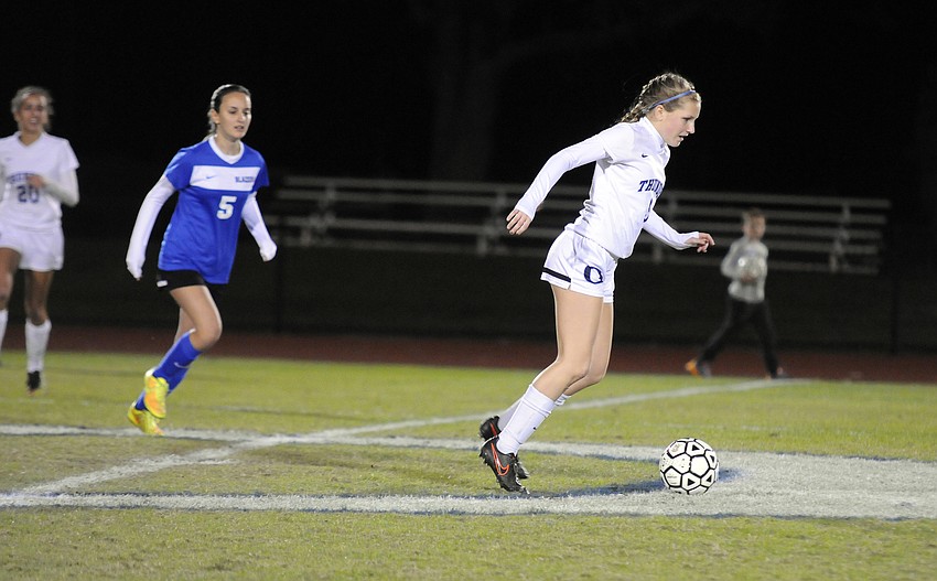 ODA's Chloe Flanders pushes the ball up the field in the first half.