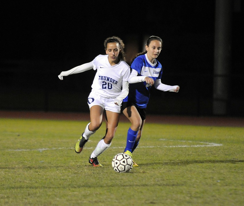 ODA's Mackenzie Condrack and Sarasota Christian's Evelyn Hagan battle for possession.