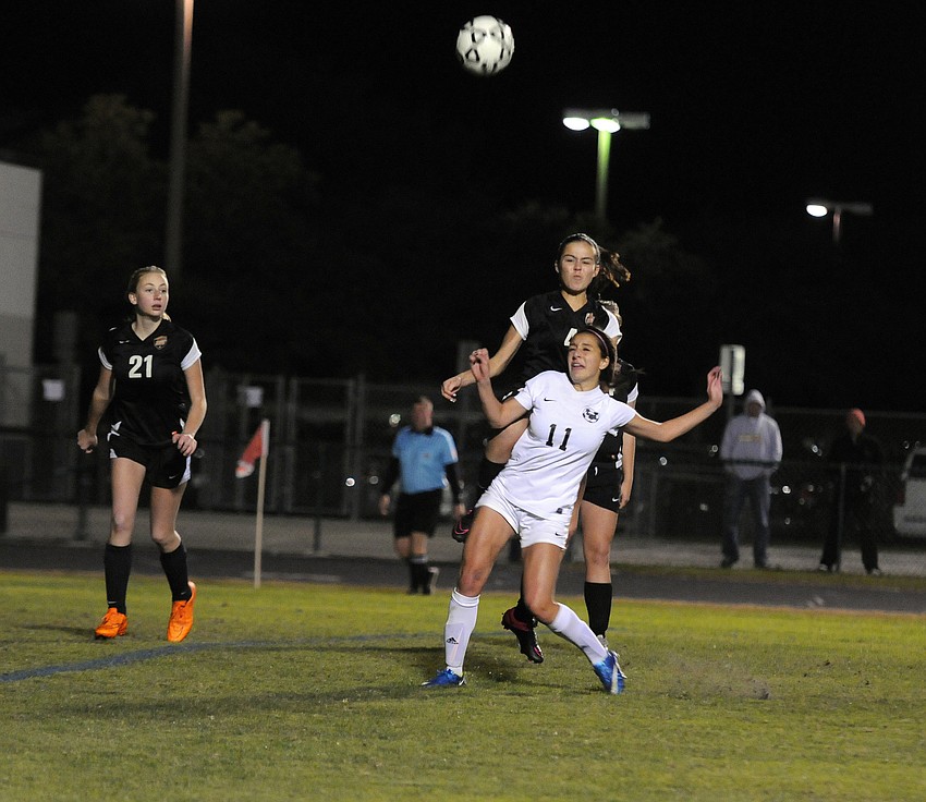 Lakewood Ranch's Maddison Krstec and Sarasota's Anna Tucker battle for the ball.