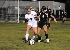 Lakewood Ranch's Sydney Wicks and Sarasota's Elizabeth Giuffre battle for the ball during the second half of their Class 5A-District 8 semifinal match Jan. 12.
