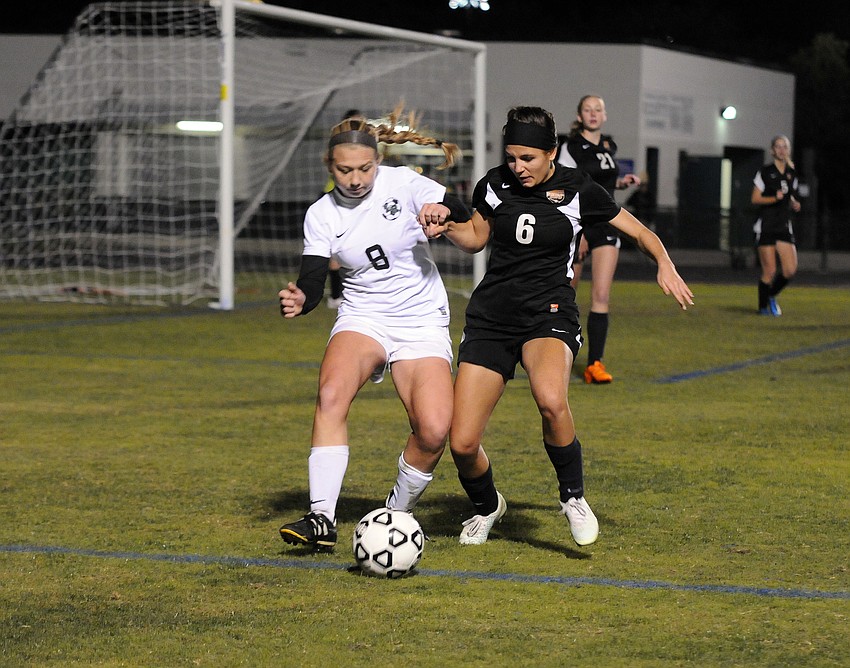 Lakewood Ranch's Sydney Wicks and Sarasota's Elizabeth Giuffre battle for the ball during the second half of their Class 5A-District 8 semifinal match Jan. 12.