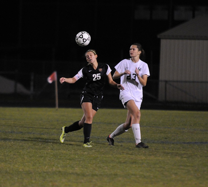 Sarasota's Kirstyn Abbate attempts to head the ball away from Lakewood Ranch's Kerestyn Kesgiropoulos.