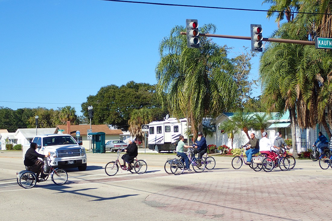 Residents of Pinecraft negotiate traffic at Kaufman and Bahia Vista.