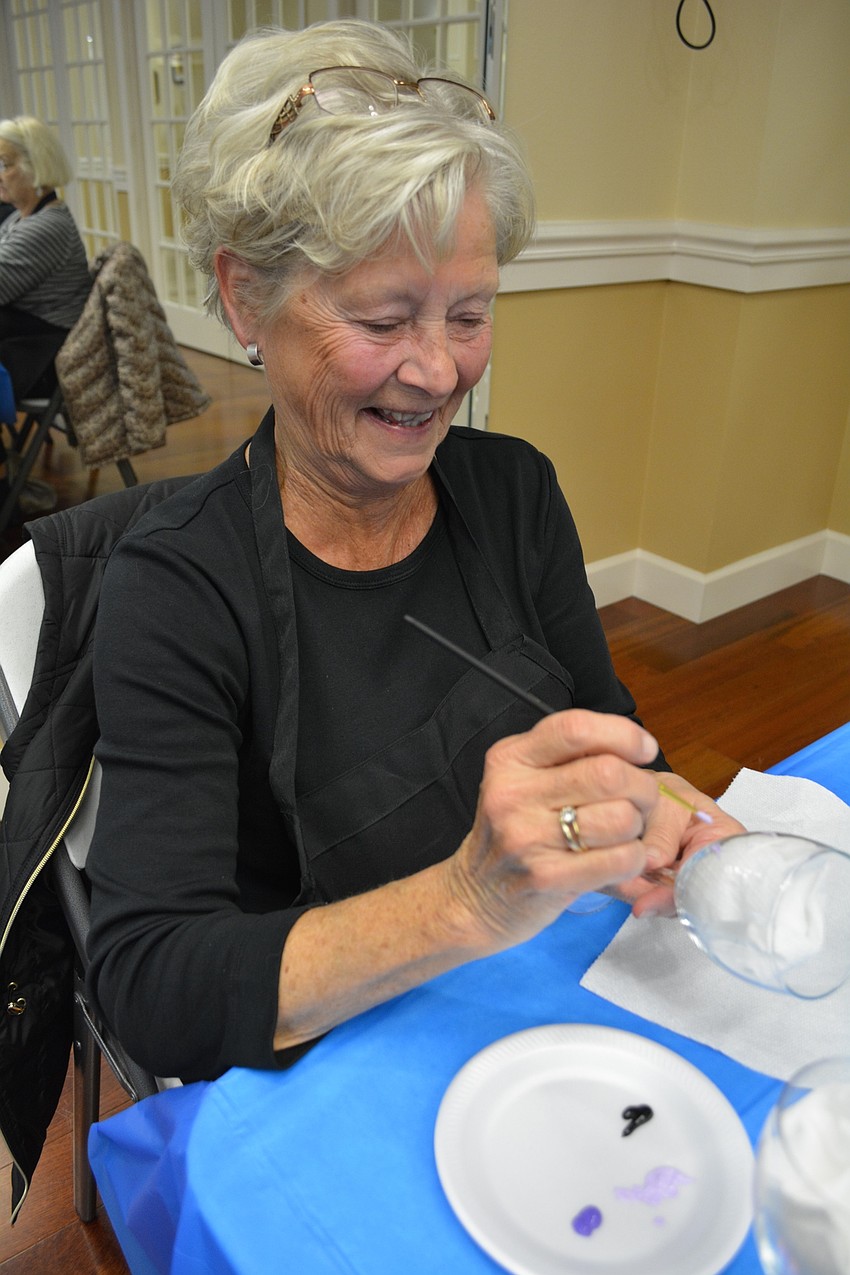 Barb O'Dell selects purple and dark blue for her flower colors.